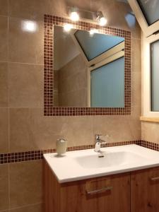 a bathroom with a sink and a mirror at ARZERIA in Cavallino di Lecce +27 photos