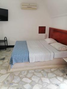 Voodi või voodid majutusasutuse Apartahotel la Posada Suite toas