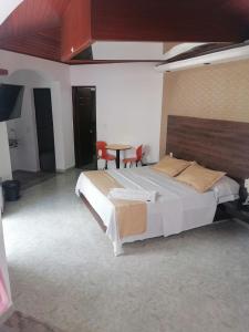 Voodi või voodid majutusasutuse Apartahotel la Posada Suite toas