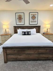 a bedroom with a large bed with two night stands at Hitching Post in Vernal