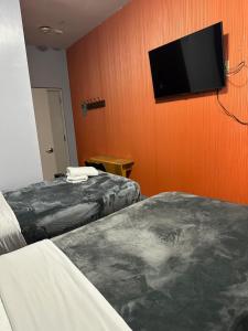 Postel nebo postele na pokoji v ubytování Essence hotel