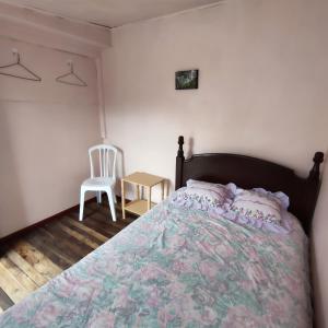 Postel nebo postele na pokoji v ubytování Conexión Urbana en el centro de Ambato + 18 fotografií