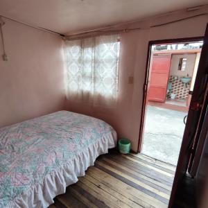 Postel nebo postele na pokoji v ubytování Conexión Urbana en el centro de Ambato