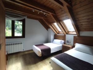 Postel nebo postele na pokoji v ubytování Casa Bielsa
