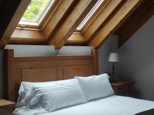 Postel nebo postele na pokoji v ubytování Casa Bielsa