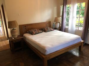 Llit o llits en una habitació de Between us : Chambres d’hôtes à Saint joseph