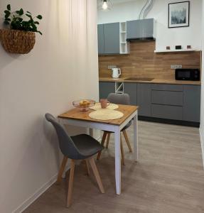 Kuchyň nebo kuchyňský kout v ubytování Apartmány U Kostela