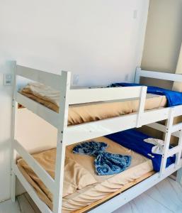 Ένα ή περισσότερα κρεβάτια σε δωμάτιο στο Areal Oceano Hostel