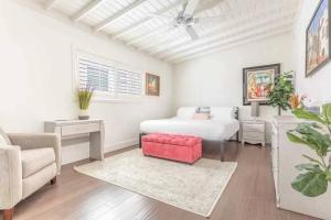 a bedroom with a bed and a couch and a chair at Walk 2 Beach, Parking, AC, WD,15min 2LAX,Remodel in Manhattan Beach