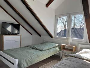 Postel nebo postele na pokoji v ubytování River House Zizi