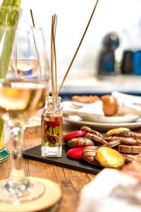 a table with a tray of food and glasses of wine at GioEstate Holiday, with Free Parking, Flat28 in Brighton & Hove
