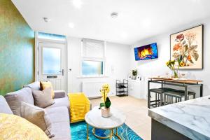 a living room with a couch and a table at GioEstate Holiday, with Free Parking, Flat28 in Brighton & Hove