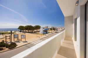 a balcony with a view of the ocean at Pontalaia Atlantic View in Sagres