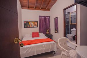 Postel nebo postele na pokoji v ubytování Hotel Palma De Sevilla