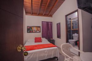 Postel nebo postele na pokoji v ubytování Hotel Palma De Sevilla