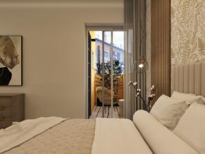 Letto o letti in una camera di Ripetta Grand Suites