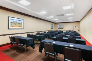 a conference room with tables and chairs in it at Best Western Plus Kansas City Sports Complex Hotel in Kansas City +37 photos