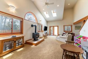 a living room with a fireplace and a couch at Stand-alone Mountain Home, Private Hot Tub and Deck by Summit County Mountain Retreats in Silverthorne