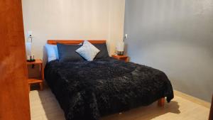 Ein Bett oder Betten in einem Zimmer der Unterkunft Piedra Negra Boutique Hotel