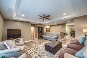 a living room with couches and a ceiling fan at CW CHB216 Club Paradise in New Braunfels