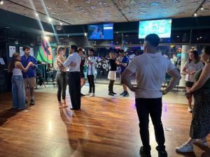 a group of people dancing on a dance floor at Viajero Buenos Aires Hostel in Buenos Aires +58 photos