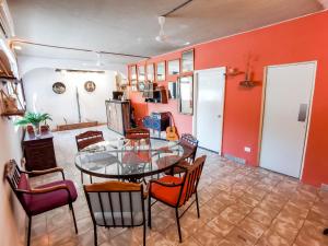 a dining room with a glass table and chairs at Hostal Casa Los Abuelos in Cuatrociénegas de Carranza +38 photos