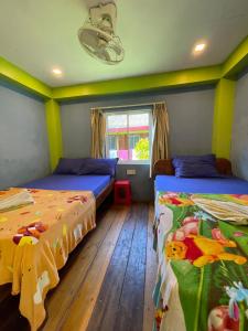 Postel nebo postele na pokoji v ubytování Villa Koh Rong
