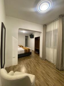 Postel nebo postele na pokoji v ubytování Hotel Rumi