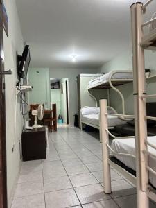 Postel nebo postele na pokoji v ubytování Kitnet Flamingo 31B