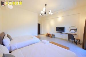 Postel nebo postele na pokoji v ubytování InYuLi Homestay花蓮縣民宿2825號