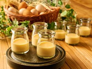 a group of jars of milk and eggs on a table at Hotel Granvia Kyoto in Kyoto