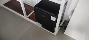 Μια τηλεόραση ή/και κέντρο ψυχαγωγίας στο Secret Kuta Apartment with Free Parking & Automated Check in 24 7