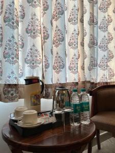 a table with a tea pot and cups on it at Ranthambhore Tiger Niwas in Sawāi Mādhopur +19 photos