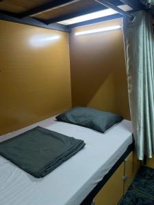 Rúm í herbergi á Hanoi New Comb Hostel