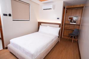 Letto o letti in una camera di Gonzales Hotel