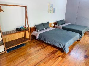 En eller flere senge i et værelse på The Light Corner Huế + 8 billeder