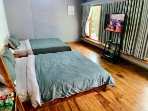 En eller flere senge i et værelse på The Light Corner Huế