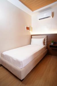 Letto o letti in una camera di Gonzales Hotel