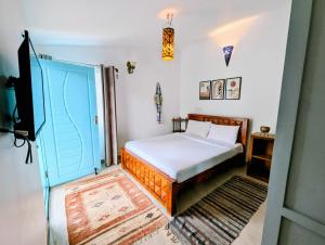 En eller flere senger på et rom på Bohemian Hideaway by Futurve