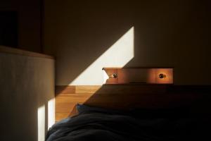 Ein Bett oder Betten in einem Zimmer der Unterkunft ist - Aokinodaira Field