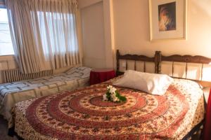 Nuevo Castillo Hotel tesisinde bir odada yatak veya yataklar
