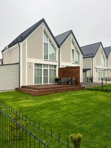 a large house with a large yard at Amber Sand apartamentai in Palanga