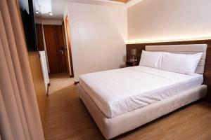 Letto o letti in una camera di Gonzales Hotel