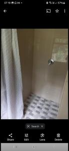 a bathroom with a shower with a shower curtain at Lubo house in Pinetown