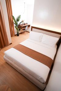 Postel nebo postele na pokoji v ubytování Gonzales Hotel