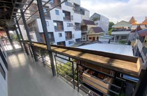 an apartment balcony with a view of a building at Hostel FUJI in Phnom Penh