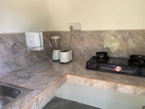 Una cocina o cocineta en Cinnamon Heaven