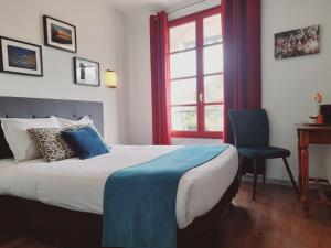 Postel nebo postele na pokoji v ubytování Hôtel Le Vauban