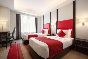 Postel nebo postele na pokoji v ubytování Ramada Encore Jalandhar + 37 fotografií