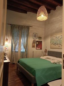 Кровать или кровати в номере We # Are ai Cassarelli